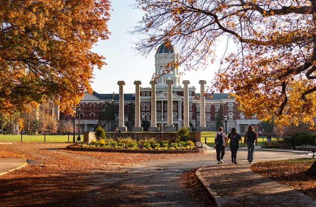 Historic campus hall and columns in autumn
